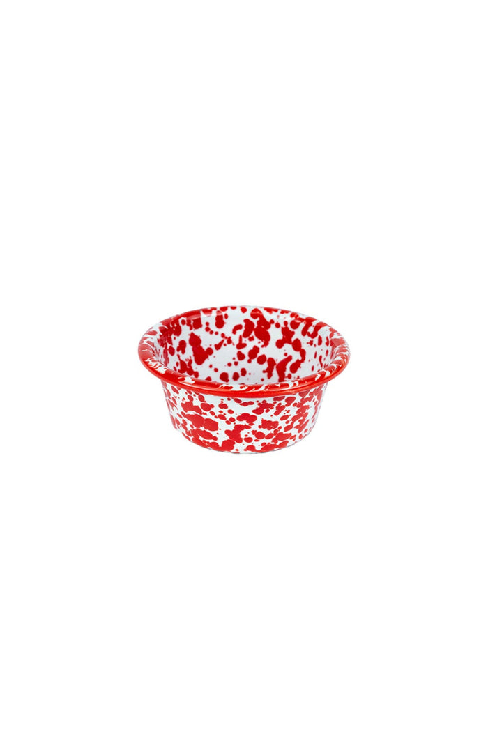 Small bowl with red and white splatter pattern on white background