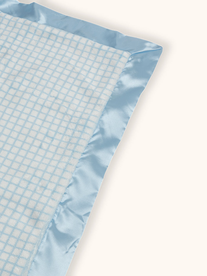 Mr. Happy Reversible Blanket showing reverse side and satin corner