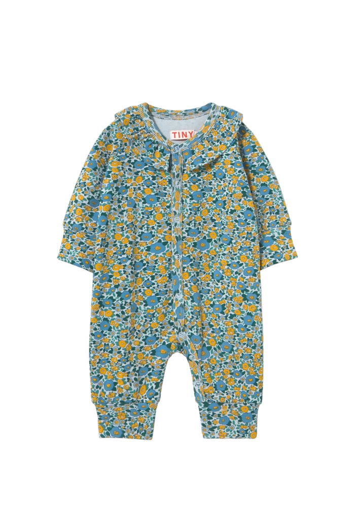 A baby long-sleeve footless one-piece romper with an all-over blue and yellow floral print, shown flat against a light cream background.