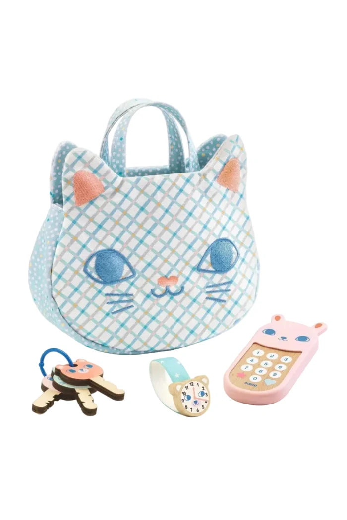 Cat-shaped toy basket with a pink phone, clock, and keys on a white background
