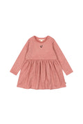 Pink dress with long sleeves on a white background
