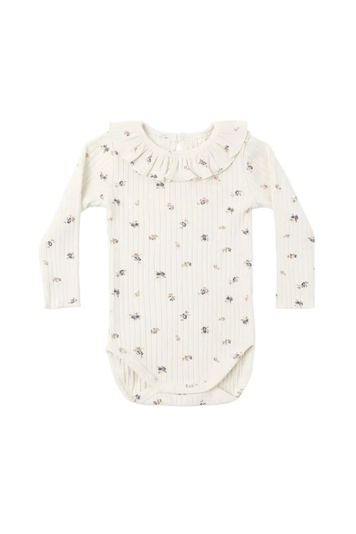 An off-white long-sleeve baby bodysuit with a delicate ruffled collar and a tiny all-over floral print, shown flat on a white background.