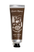 Hand cream tube labeled 'Flower Market Sandalwood' on a white background