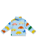 A light blue long-sleeve turtleneck top for toddlers, featuring a playful pattern of colorful cartoon cars in yellow, orange, green, pink, and blue.
