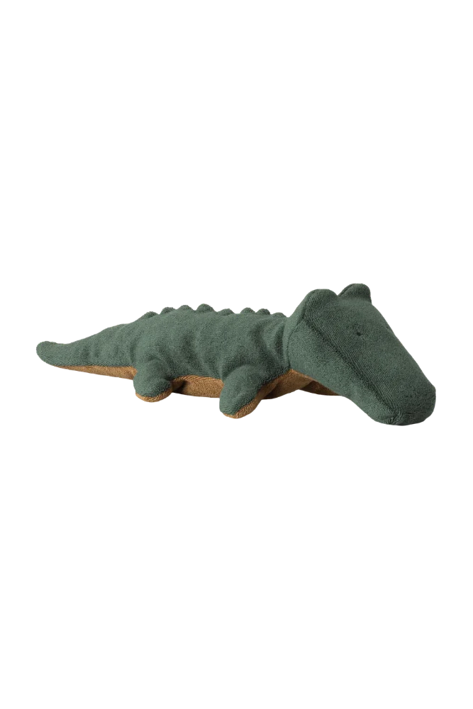 Green plush alligator toy on a white background