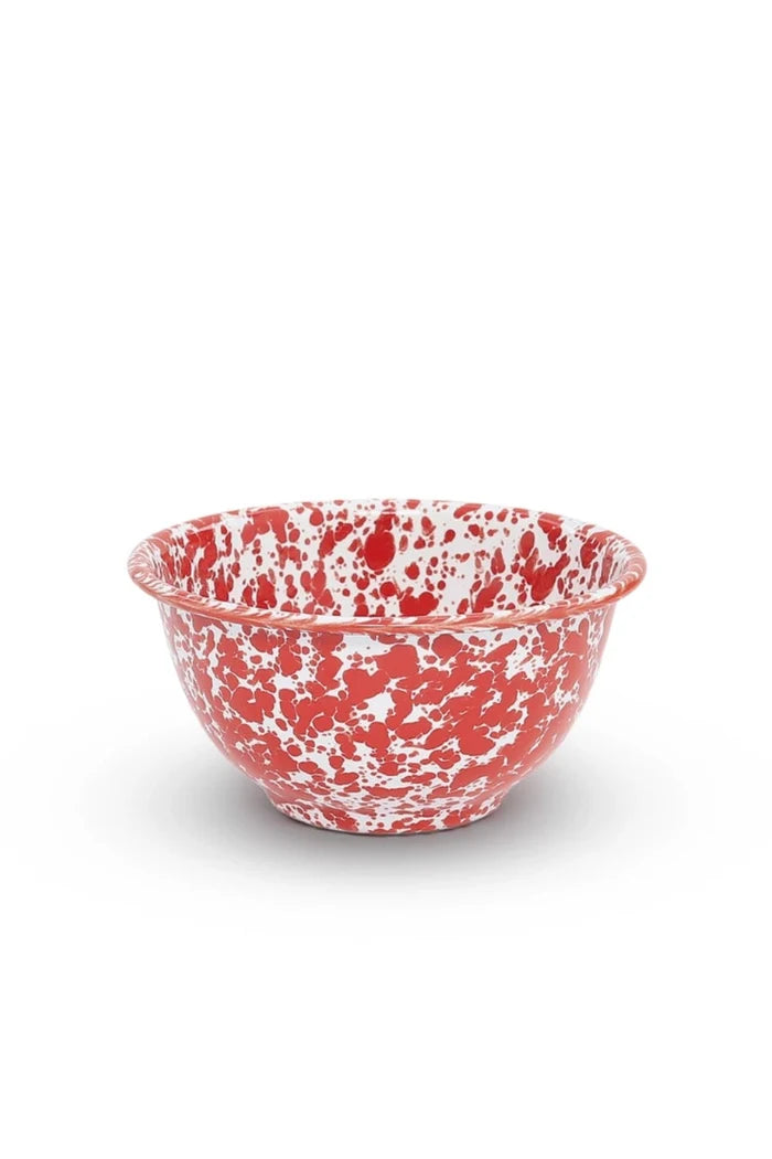 Red speckled ceramic bowl on a white background
