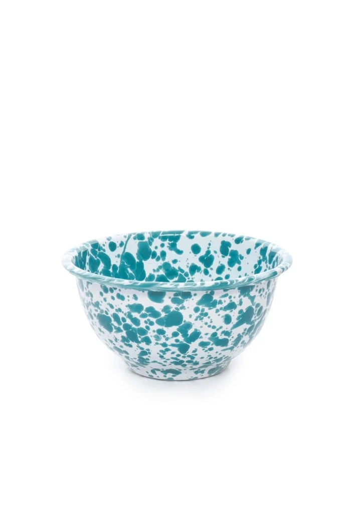 Teal and white splatter textured bowl on a white background