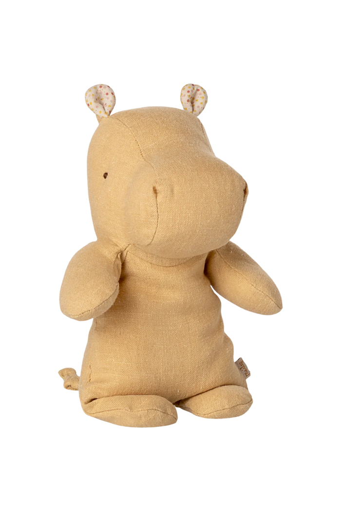 Beige plush hippo toy on a white background