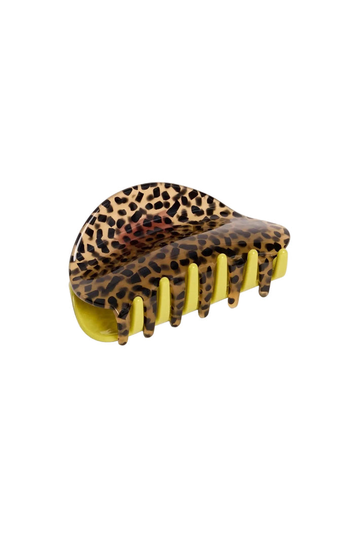 Leopard print hair clip with yellow base on a white background