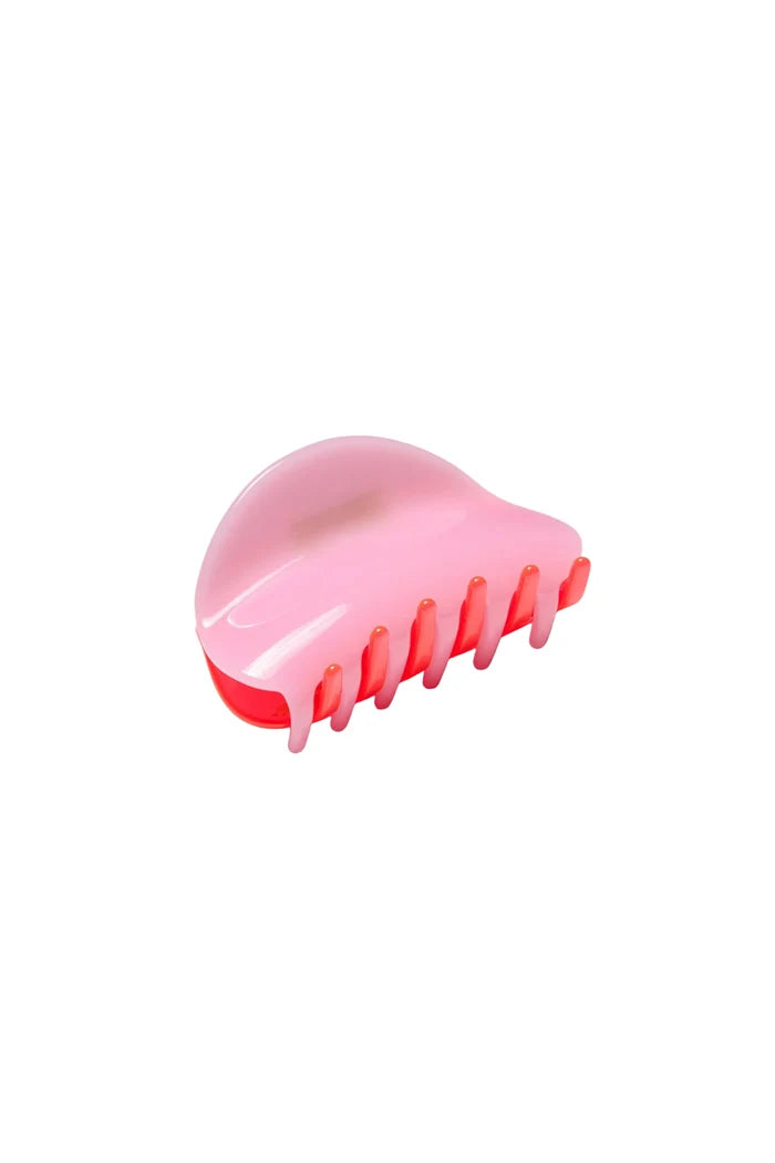 Bright pink and red hair claw clip on white background