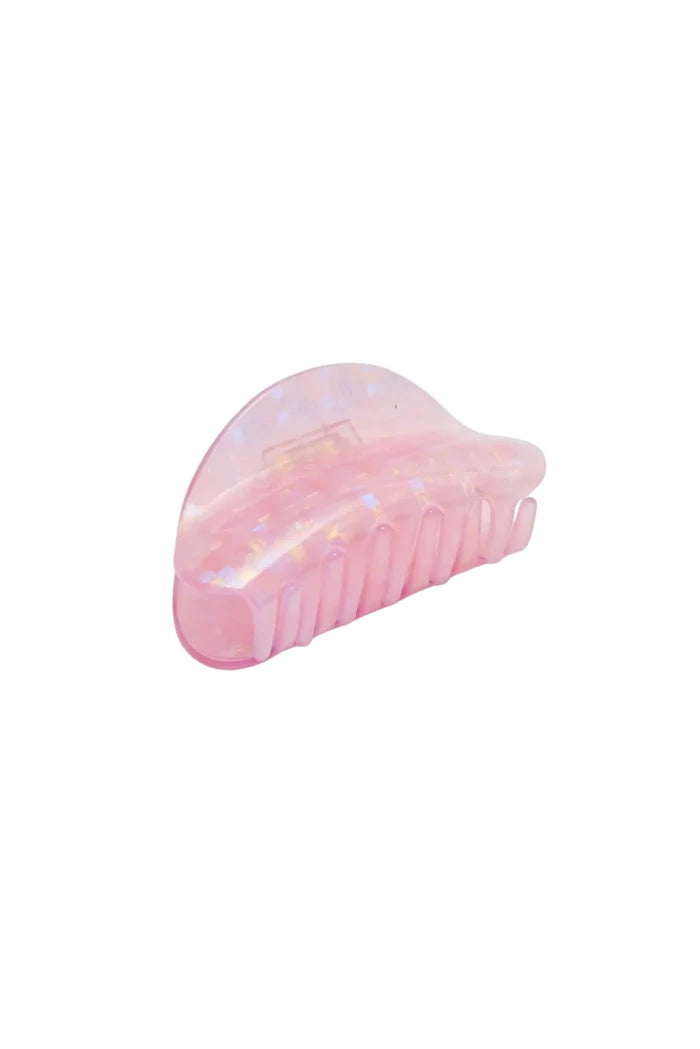 Iridescent pink hair claw clip on white background