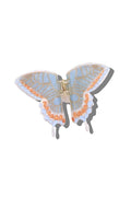 Butterfly-shaped hair clip with blue and orange design on a white background