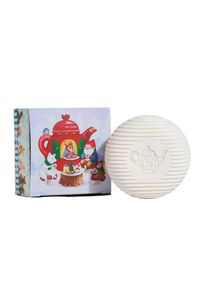 White textured soap with teapot design next to a colorful box with a teapot illustration on a white background