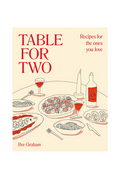Book cover of 'Table for Two' with illustrations of a dinner table and red text on a beige background.
