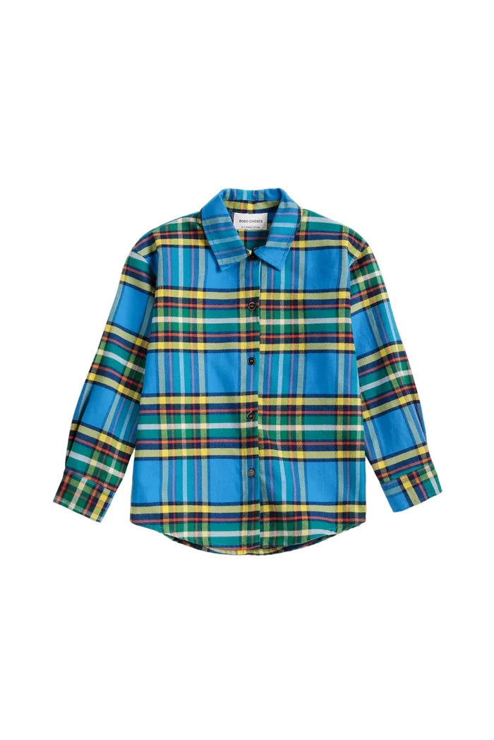 A long-sleeve button-up shirt with a vibrant blue, green, yellow, and red plaid pattern, displayed flat against a light gray background.