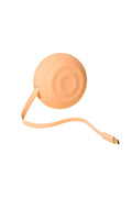 A peach-colored silicone portable charger with a matching cable, displayed on a solid light beige background.