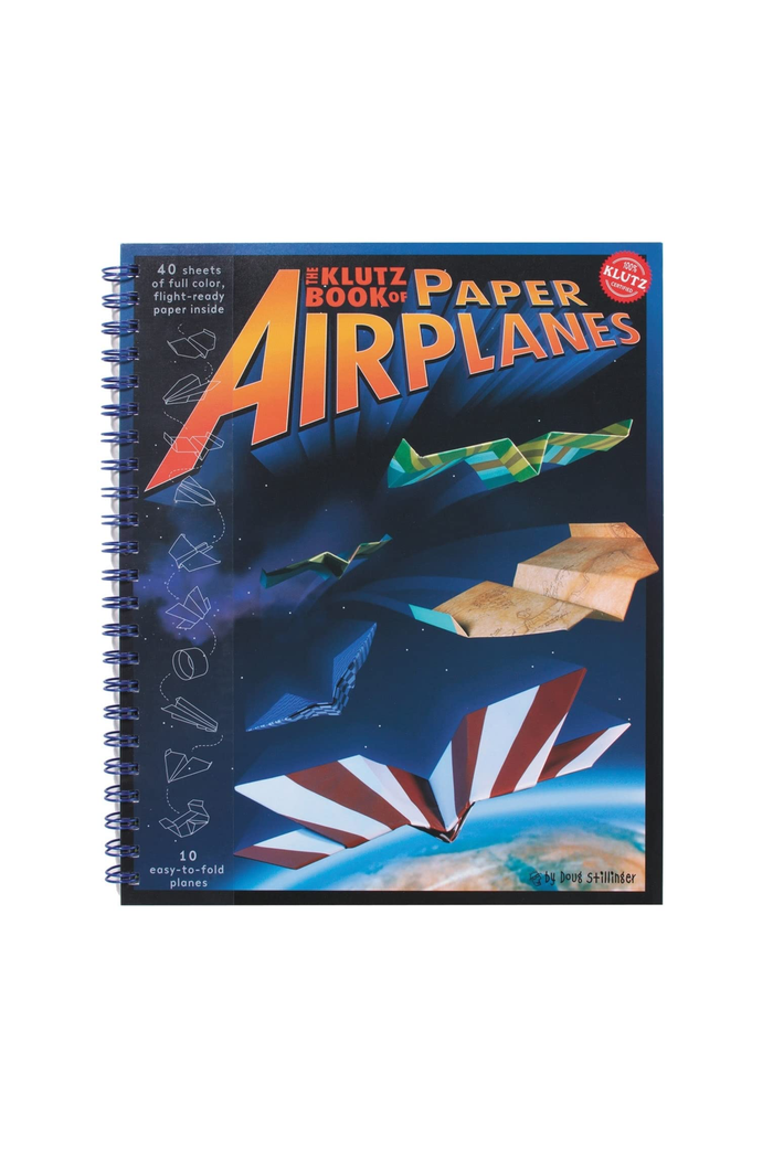 Klutz Book of Paper Airplanes spiral-bound activity book with a dark blue cover featuring colorful paper airplane illustrations and bold orange title text.