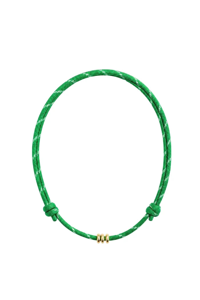 A green adjustable cord necklace with a small gold triple-bead clasp, displayed on a clean white background.