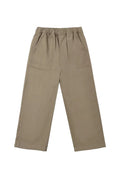 A pair of wide-leg trousers in a muted taupe-brown color, featuring an elastic waistband and two large front patch pockets, shown flat on a light gray background.