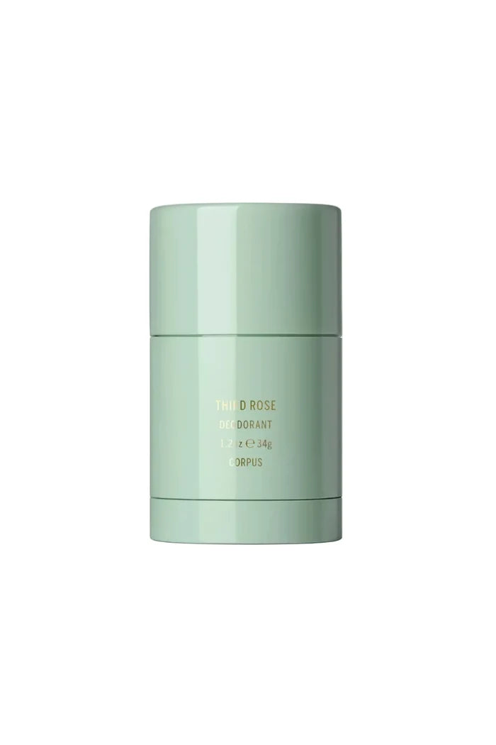 Green plastic deodorant stick on white background
