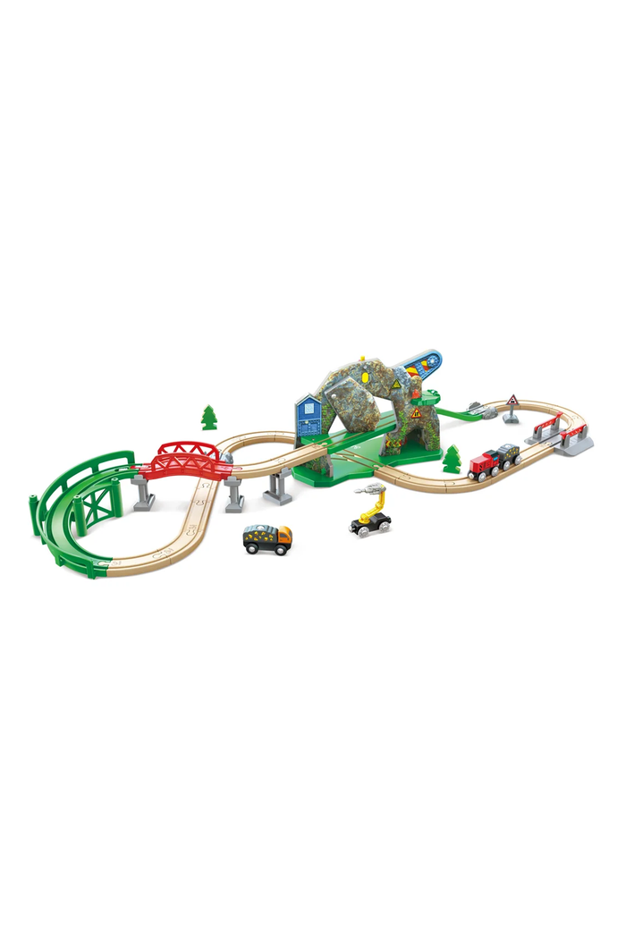 A children's wooden train track set with curved tracks, a red bridge, green supports, a mountain tunnel, small toy cars, and a small train, shown on a plain white background.