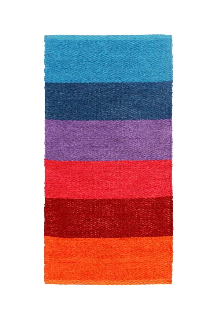 A rectangular woven rug with horizontal stripes in shades of blue, purple, red, and orange, shown flat against a white background.