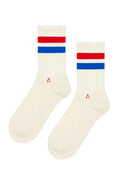 Pair of cream socks with red and blue stripes on a white background