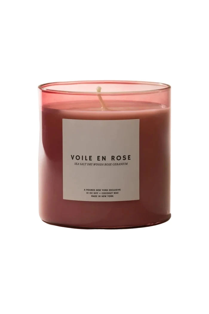 Pink candle labeled 'Voile en Rose' on a beige background