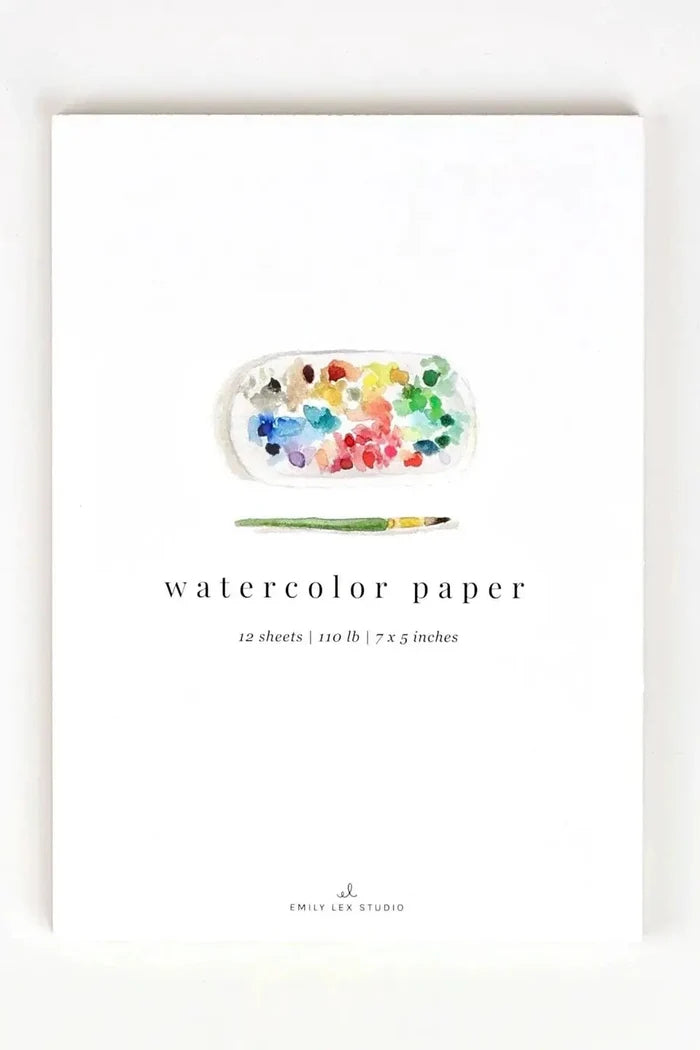 Watercolor paper set with a paint palette and brush on a white background