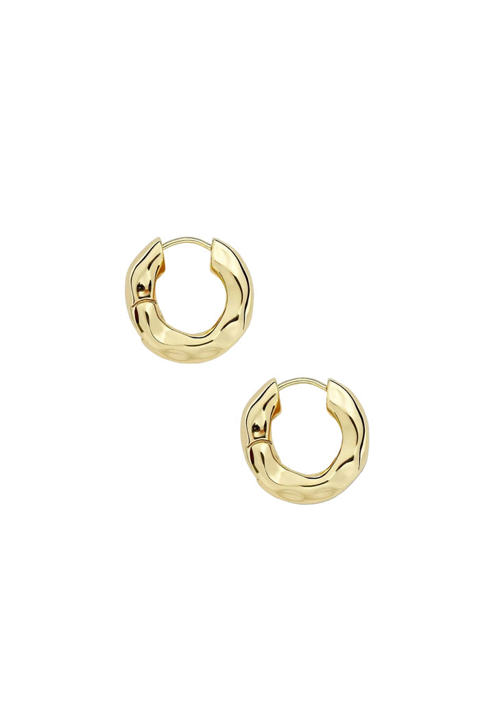 A pair of gold chunky hoop earrings with an organic texture, displayed against a white background.
