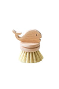 Wooden brush with a whale design on a white background