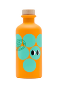 An orange bottle of Greek balsamic vinegar with a cork stopper, decorated with large teal circles and a cartoon face, on a white background.