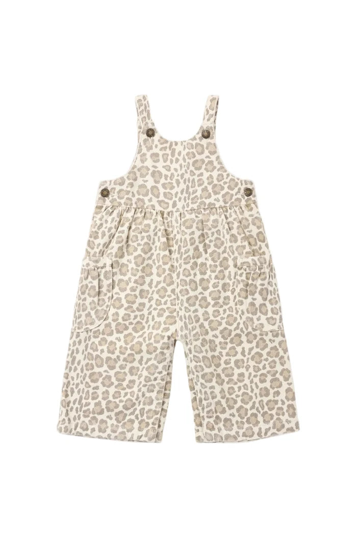 A baby's sleeveless overall romper with a beige and brown leopard print pattern, featuring adjustable shoulder straps with decorative buttons, photographed flat on a light gray background.