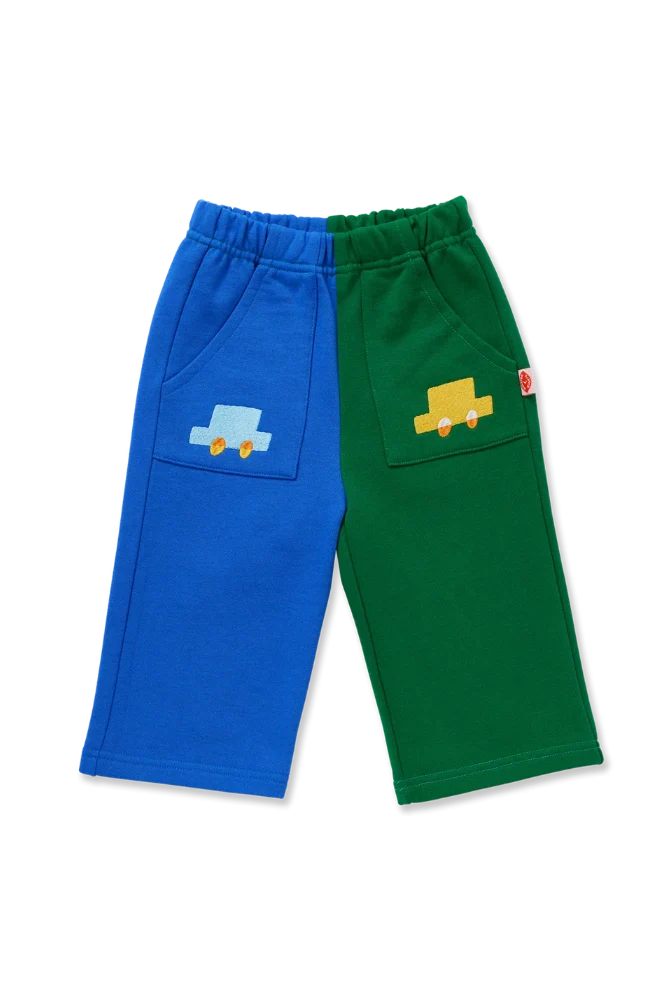 A pair of children's sweat pants, Each leg features a large patch pocket with a small embroidered truck motif.