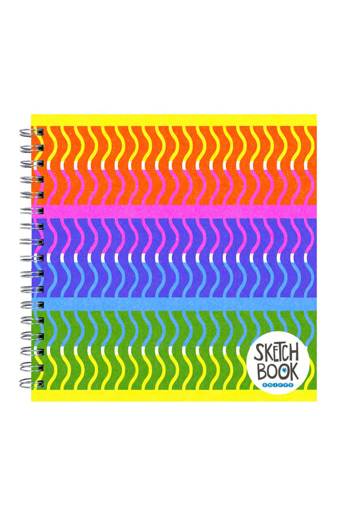 Colorful spiral-bound sketchbook with wavy pattern on a white background