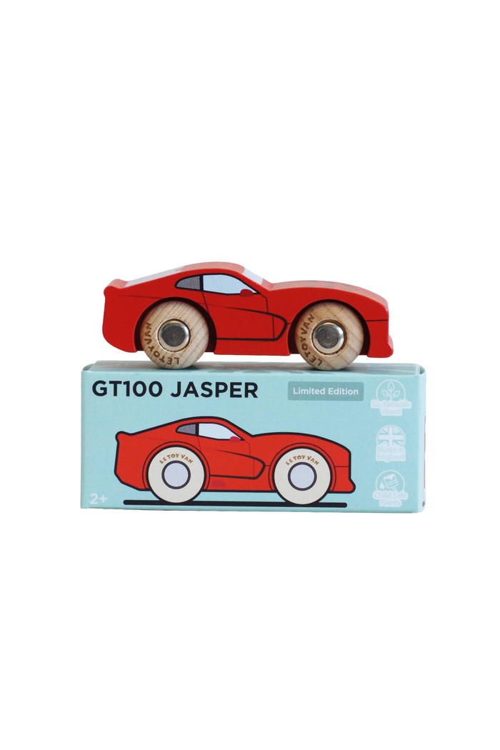 A red wooden toy car with natural wood wheels, displayed on top of its light blue packaging box labeled 'GT100 JASPER' against a plain white background.