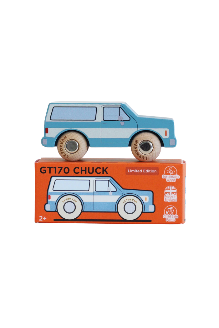 A wooden toy car named 'GT170 CHUCK' in a limited edition blue and white colorway, shown resting on top of its orange retail packaging box against a plain white background.