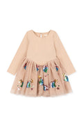 A long-sleeve children's dress in light beige with a solid upper bodice and a tulle skirt decorated with colorful star appliqués, shown on a plain white background.